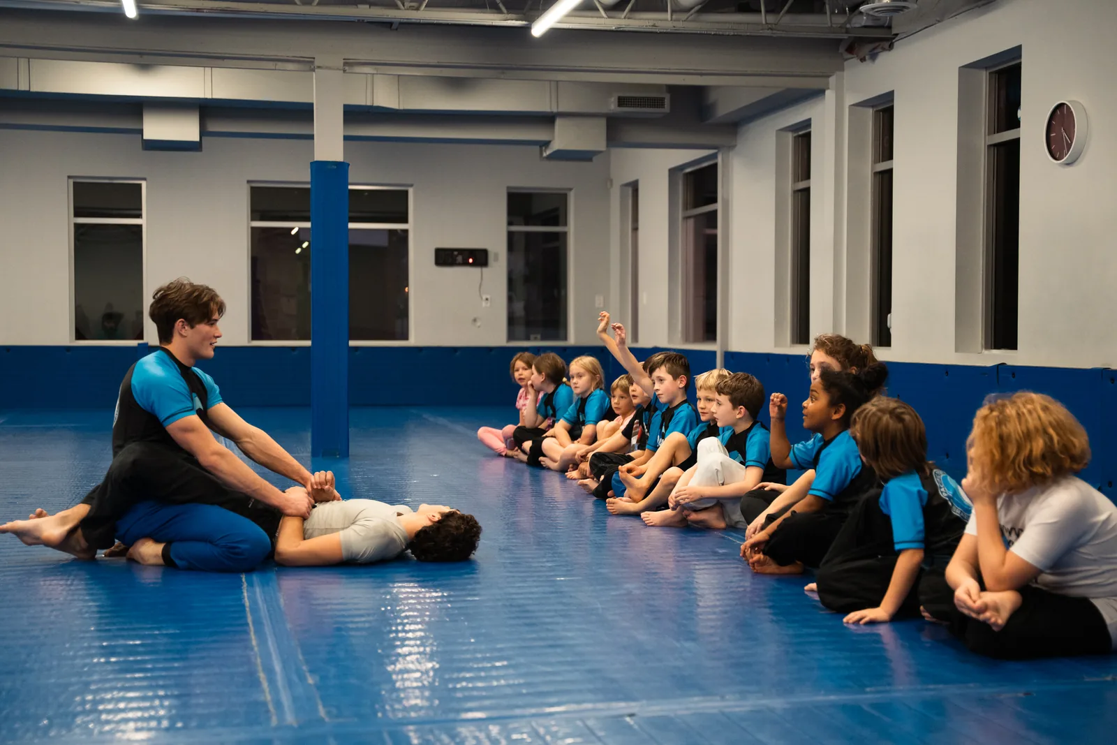 Coach leading a structured Jiu-Jitsu class for kids during the after-school program at Pacific Top Team Penticton