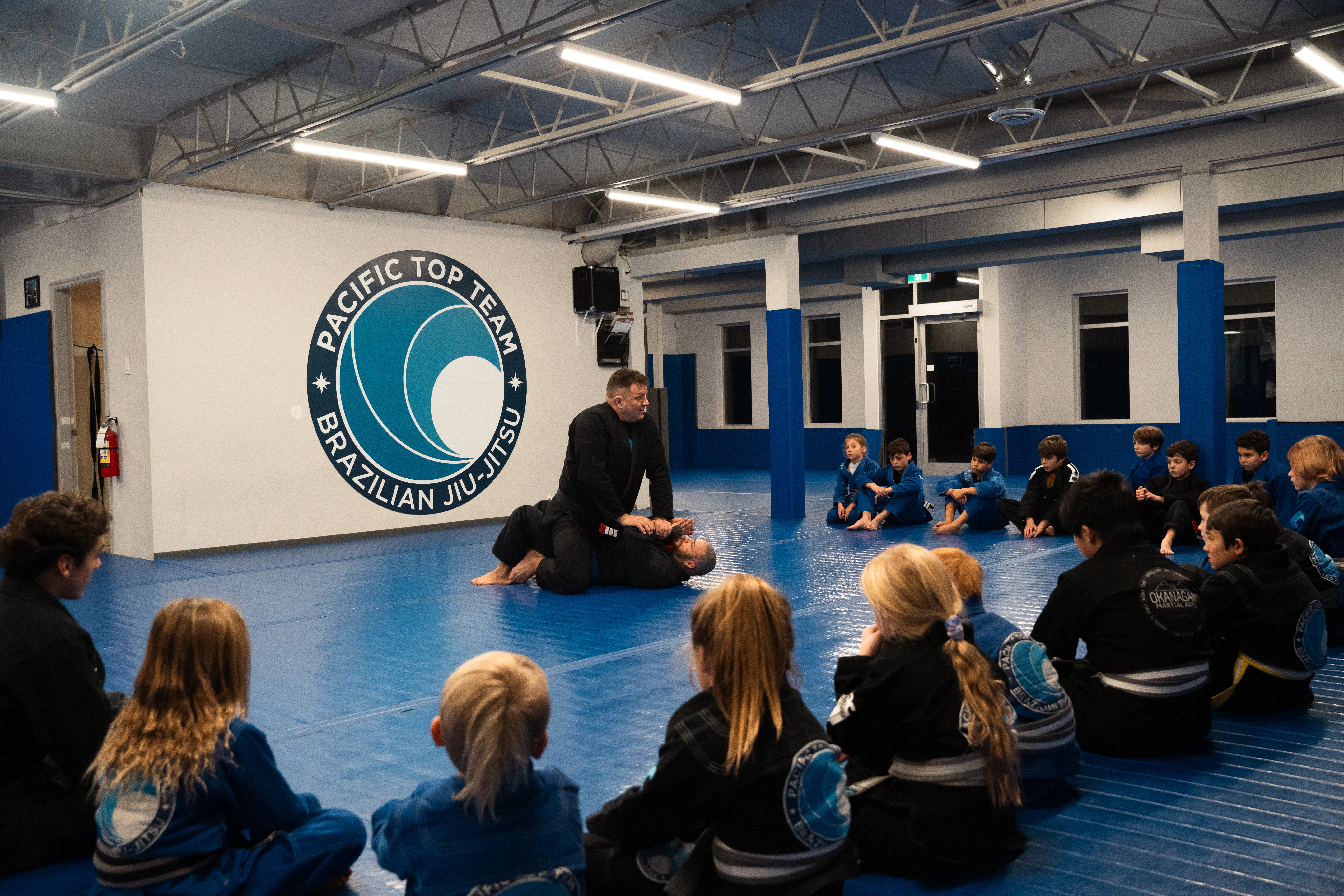 Kids BJJ class with Pacific Top Team logo at Pacific Top Team Penticton